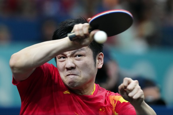 China&#039;s Fan Zhendong plays against Sweden&#039;s Truls Moregard during the men&#039;s gold medal team table tennis match at the 2024 Summer Olympics, Friday, Aug. 9, 2024, in Paris, France. (AP P ...