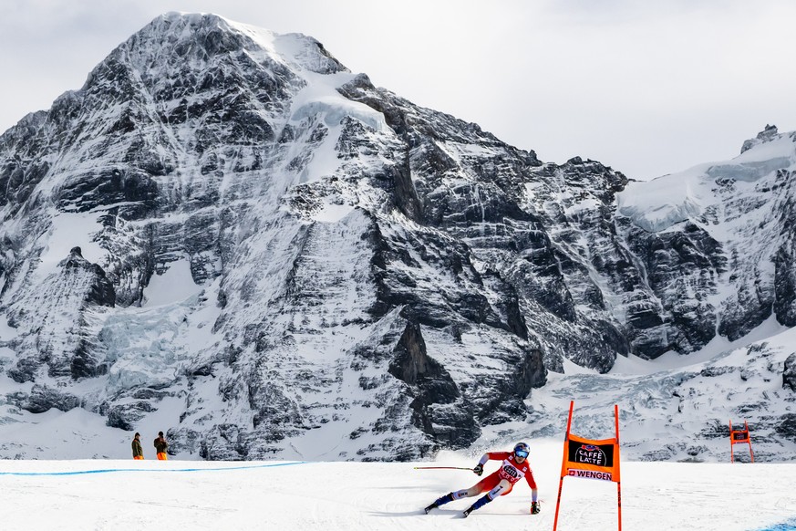 Marco Odermatt of Switzerland in action front of the Moench mountain during the men's Downhill training race at the Alpine Skiing FIS Ski World Cup, in Wengen, Switzerland, Tuesday, January 13, 2 ...