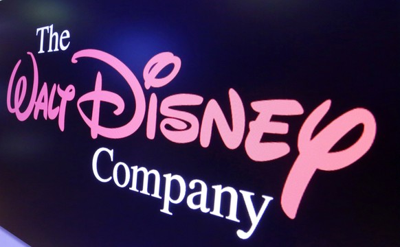 FILE - The Walt Disney Co. logo appears on a screen above the floor of the New York Stock Exchange on Aug. 7, 2017. Disney reported narrower losses on its Disney+ streaming platform in the quarter end ...