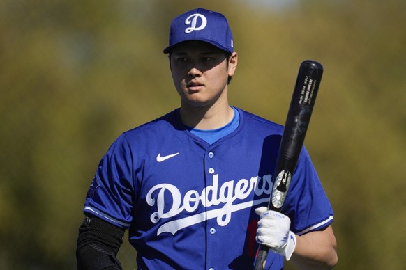 Los Angeles Dodgers designated hitter Shohei Ohtani participates in spring training baseball workouts at Camelback Ranch in Phoenix, Friday, Feb. 16, 2024. (AP Photo/Ashley Landis)
