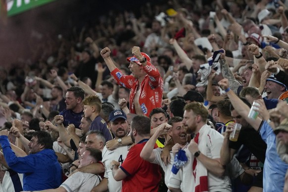 Fans celebrate after England&#039;s Ollie Watkins scores his side&#039;s 2nd goal against Netherlands during a semifinal at the Euro 2024 soccer tournament in Dortmund, Germany, Wednesday, July 10, 20 ...