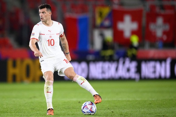 Switzerland&#039;s midfielder Granit Xhaka runs with the ball during the UEFA Nations League group A2 soccer match between Czech Republic and Switzerland at the Eden Arena, Sinobo Stadium, in Prague,  ...