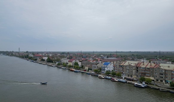 A dredging vessel is deepening the navigation channel near a modernized quay in Sulina city, Romania, on May 8, 2026. Many Romanians living near the border feel unprotected as dozens of airspace breac ...