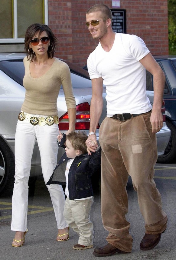 Manchester United soccer player David Beckham and his Spice Girl wife Victoria Beckham, arrive with their son Brooklyn for his second birthday party at the Wacky Warehouse, at Alderley Edge, England,  ...