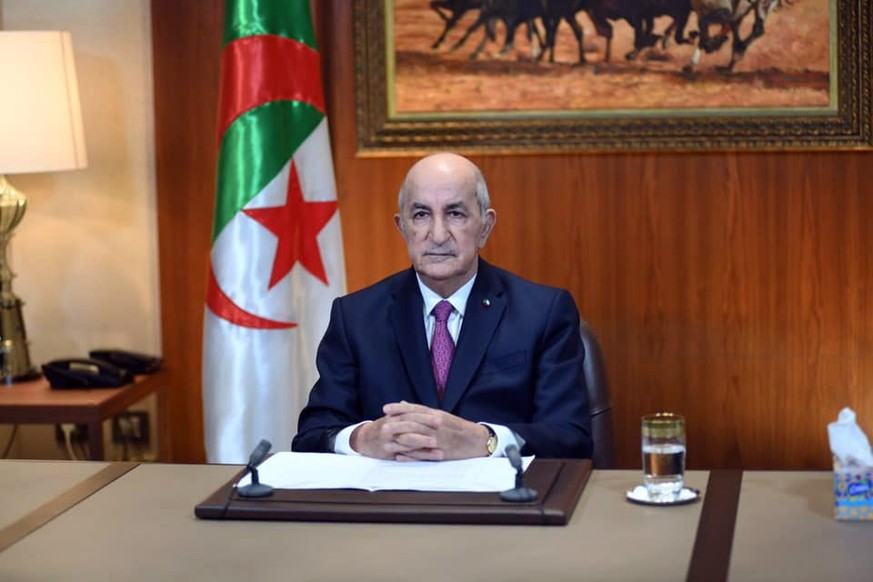 epa09022390 A handout photo made available by the Algeria Presidency Press Service shows Algerian President Abdelmadjid Tebboune during his speech at the Presidential Palace in Algiers, Algeria, 18 Fe ...