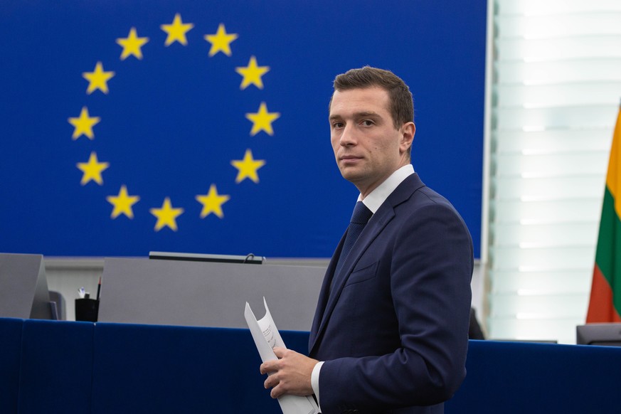 epa11647927 Chairman of the right-wing &#039;Patriots for Europe&#039; group Jordan Bardella looks on during a debate on the 07 October Hamas attacks on Israel during a session at the European Parliam ...