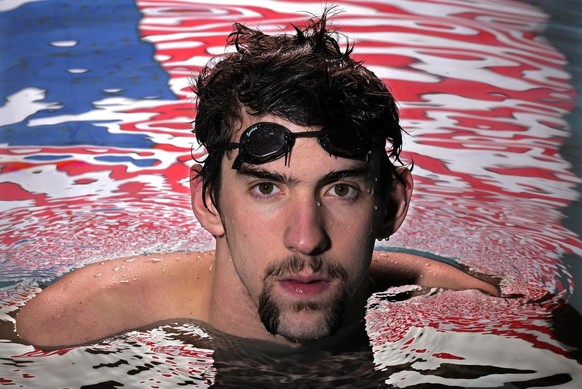 Olympic gold medalist Michael Phelps poses in the Belmont Plaza Olympic Pool, Friday, Jan. 18, 2008, in Long Beach, Calif. Phelps is entered in nine events over three days starting Saturday at the Sou ...
