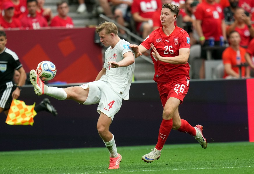 epa13061897 Luc de Fougerolles of Canada (L) and Cedric Itten of Switzerland in action during the FIFA World Cup 2026 group stage match Switzerland against Canada, in Vancouver, Canada, 24 June 2026.  ...
