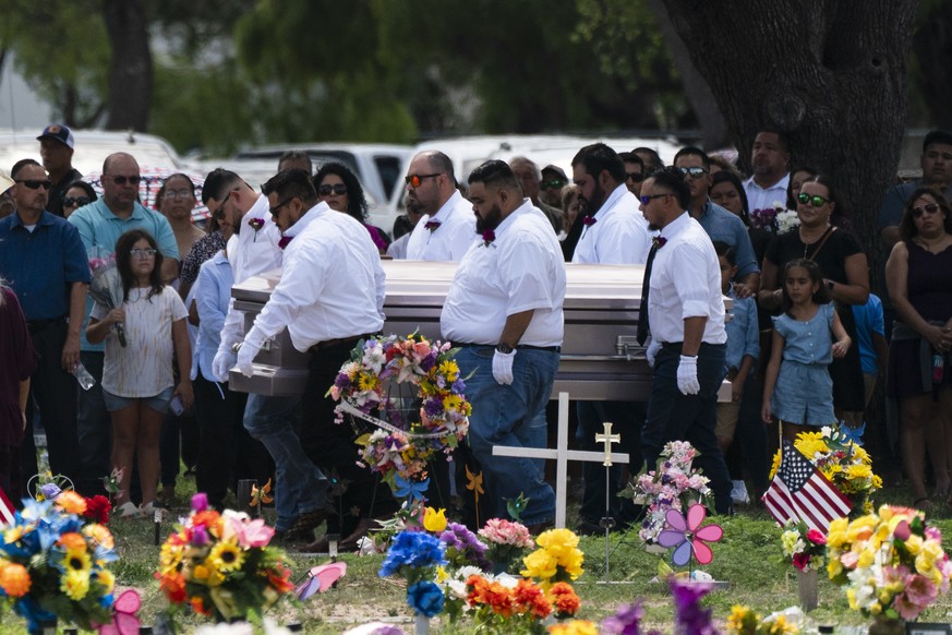 Pallbearers carry the casket of Amerie Jo Garza to her burial site in Uvalde, Texas, Tuesday, May 31, 2022. Garza was one of the students killed in last week&#039;s shooting at Robb Elementary School. ...