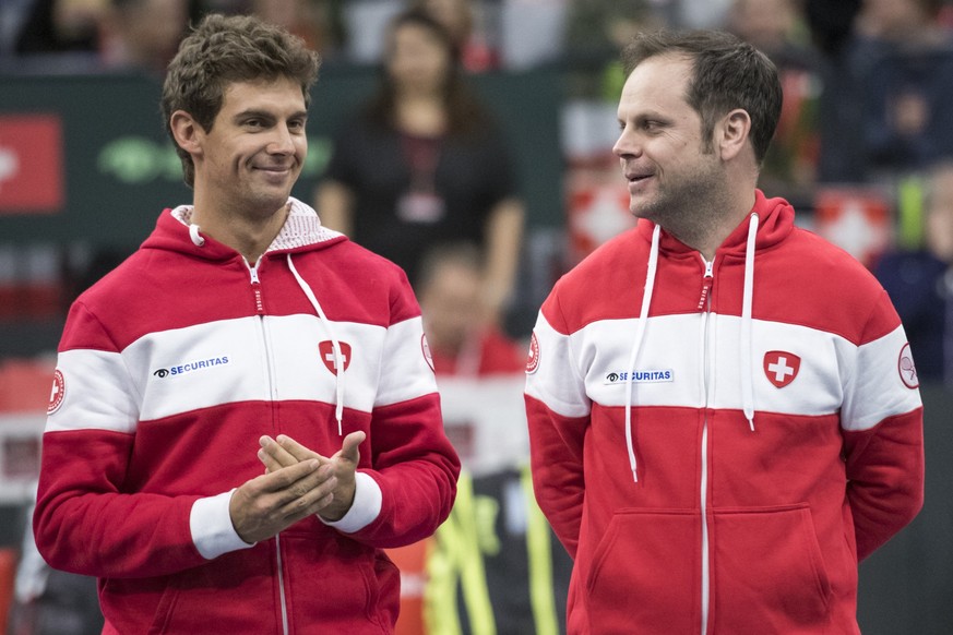 Switzerland&#039;s Henri Laaksonen, and team captain Severin Luethi, during the double match of the Davis Cup qualification final round between Switzerland and Russia at the Swiss Tennis Arena in Biel ...