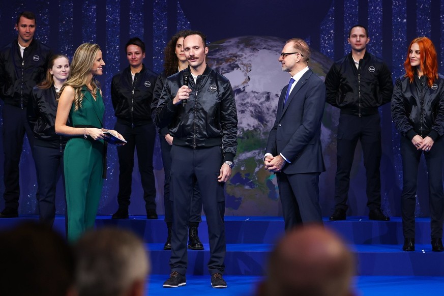 European Space Agency (ESA) new class astronaut Marco Sieber of Switzerland (C) during a ceremony of unveiling the European Space Agency new class of career astronauts at Grand Palais Ephemere in Pari ...