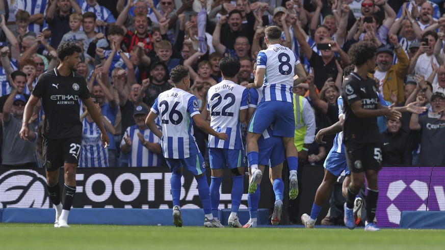 Brighton and Hove Albion players celebrate after Brighton&#039;s James Milner scored his side&#039;s opening goal during the English Premier League soccer match between Brighton and Hove Albion and Ma ...