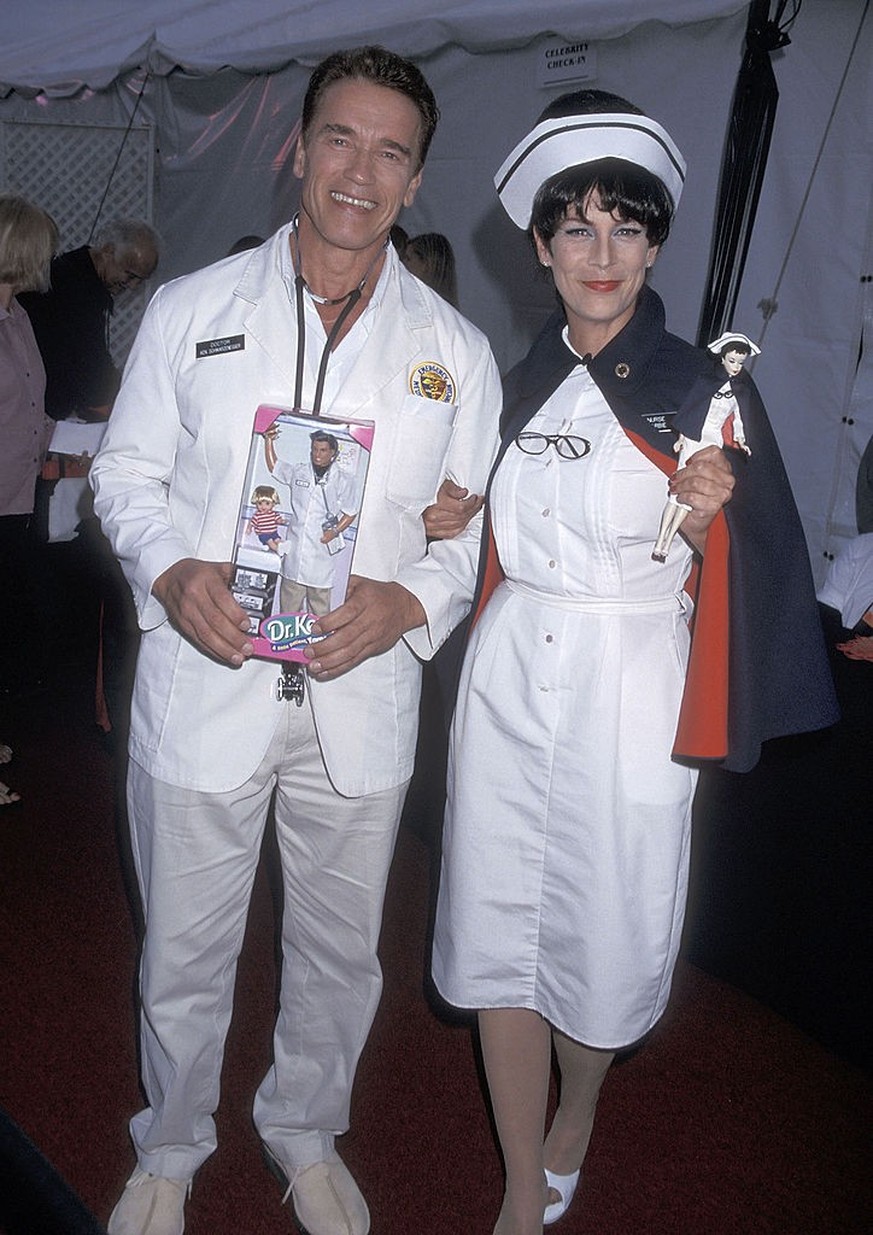 Actor Arnold Schwarzenegger and actress Jamie Lee Curtis attend the Eighth Annual Dream Halloween Benefit for Children Affected by AIDS on October 27, 2001 at the Barker Hangar, Santa Monica Air Cente ...