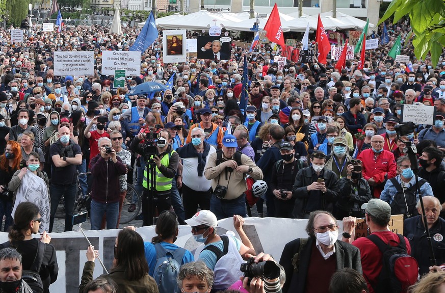 epa09234063 Slovenian citizens protest against Government and Prime Minister Janez Jansa outside Government building in Ljubljana, Slovenia, 28 May 2021. More than 40.000 people gathered in Ljubljana  ...