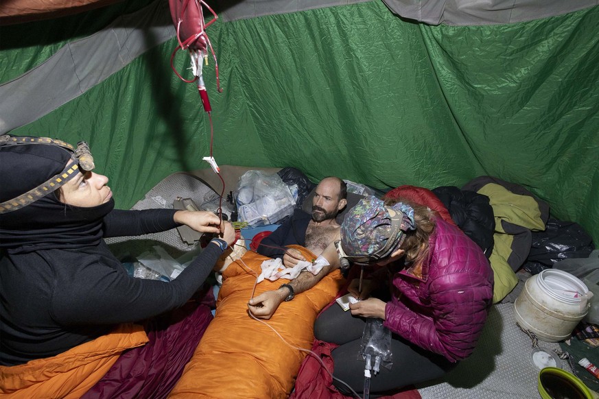 A medical team takes care of American caver Mark Dickey, center, 40, inside the Morca cave near Anamur, southern Turkey, Saturday, Sept. 9, 2023. Rescue teams began the arduous process Saturday of ext ...