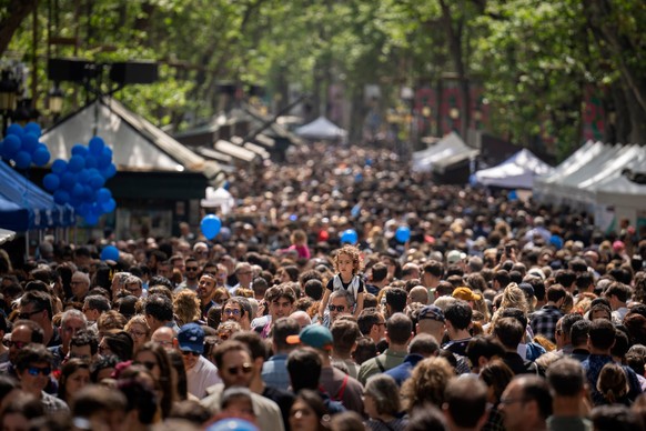 FILE - People crowd along the historic La Rambla promenade of Barcelona as Catalans celebrate the day of their patron Sant Jordi, Spain, Sunday, April 23, 2023. (AP Photo/Emilio Morenatti, File)
Spain ...