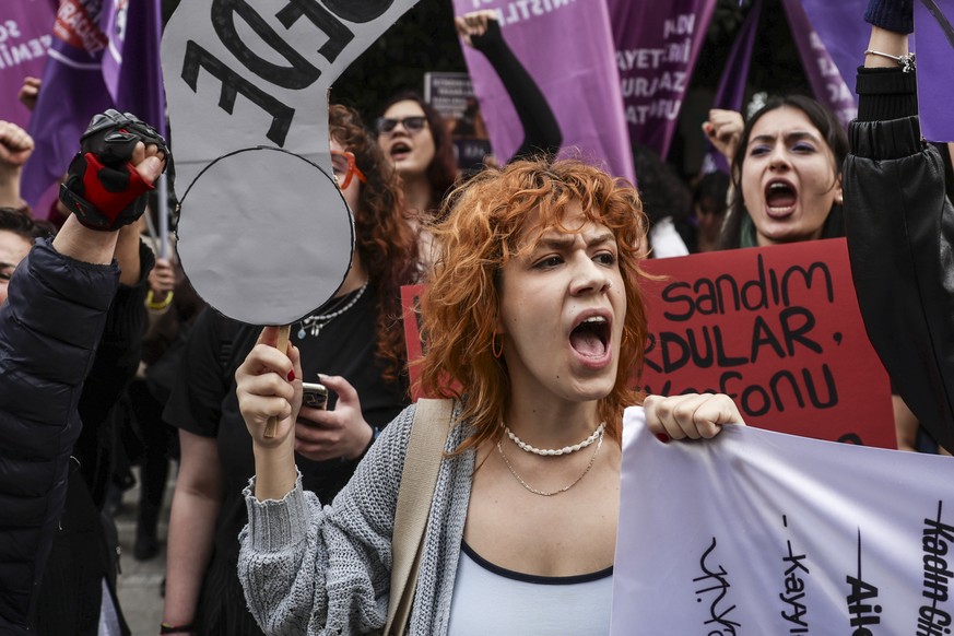 epa12544136 Protesters hold placards and shout slogans during a protest ahead of the International Day for the Elimination of Violence Against Women in Istanbul, Turkey, 25 November 2025. The Internat ...