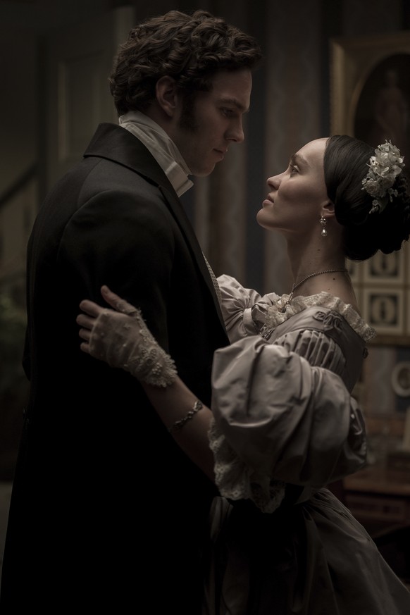 This image released by Focus Features shows Nicholas Hoult, left, and Lily-Rose Depp in a scene from &quot;Nosferatu.&quot; (Focus Features via AP)