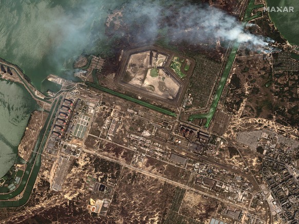 This satellite image provided by Maxar Technologies shows bush fires outside of the main power plant facilities at the Zaporizhzhia nuclear plant in Russian occupied Ukraine, Monday Aug. 29, 2022. A t ...