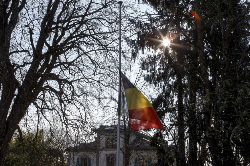 A Belgium flag flies at half mast at the residence of Belgian ambassador after terrorist attacks in Brussels, in Geneva, Switzerland, Wednesday, March 23, 2016. At least 31 people have been killed wit ...