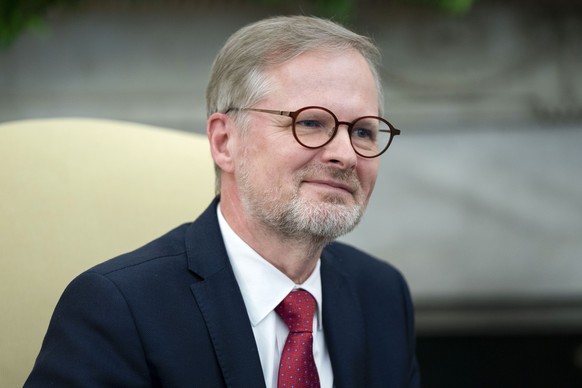 epa11280969 Czech Republic&#039;s Prime Minister Petr Fiala looks on during a meeting with US president in the Oval Office at the White House in Washington, DC, USA, 15 April 2024. EPA/BONNIE CASH / P ...