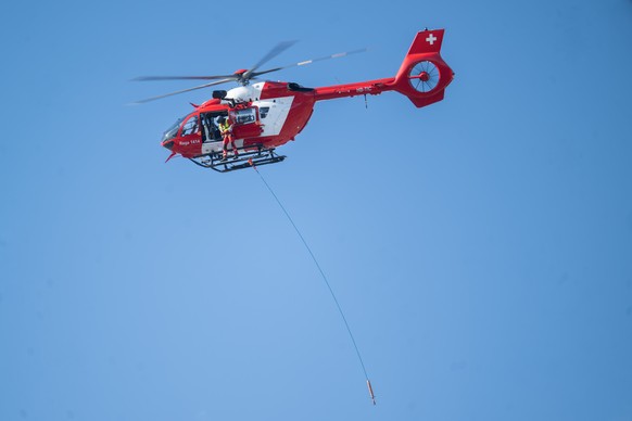 The new Airbus H 145 D3 based at the REGA base in Magadino in flight, during the REGA exercise involving the evacuation of the Monte Tamaro cable car, Rivera, Wednesday 18 March 2026..(KEYSTONE/Ti-Pre ...