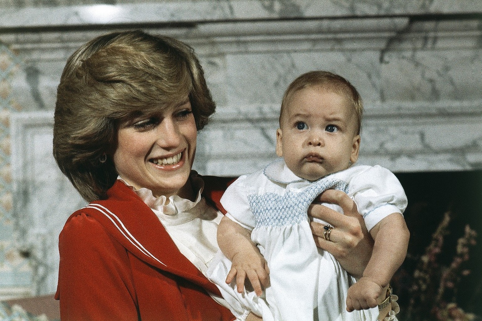 FILE - In this file photo dated Dec. 22, 1982 Britain&#039;s Prince William, the 6-month old son of British Prince Charles and Princess Diana, at Kensington Palace in London. The Princes William and H ...