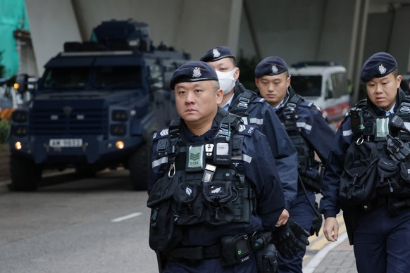 epa12718951 Members of Hong Kong Police stay outside ofthe West Kowloon Magistrates' Courts, before the delivery of the sentence for Jimmy Lai, in Hong Kong, China, 09 February, 2026. A court in  ...
