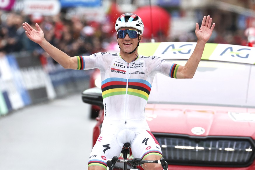 Belgium's Remco Evenepoel of the Soudal Quick Step team crosses the finish line to win the Belgian cycling classic and UCI World Tour race Liege Bastogne Liege, in Liege, Belgium, Sunday, April 2 ...