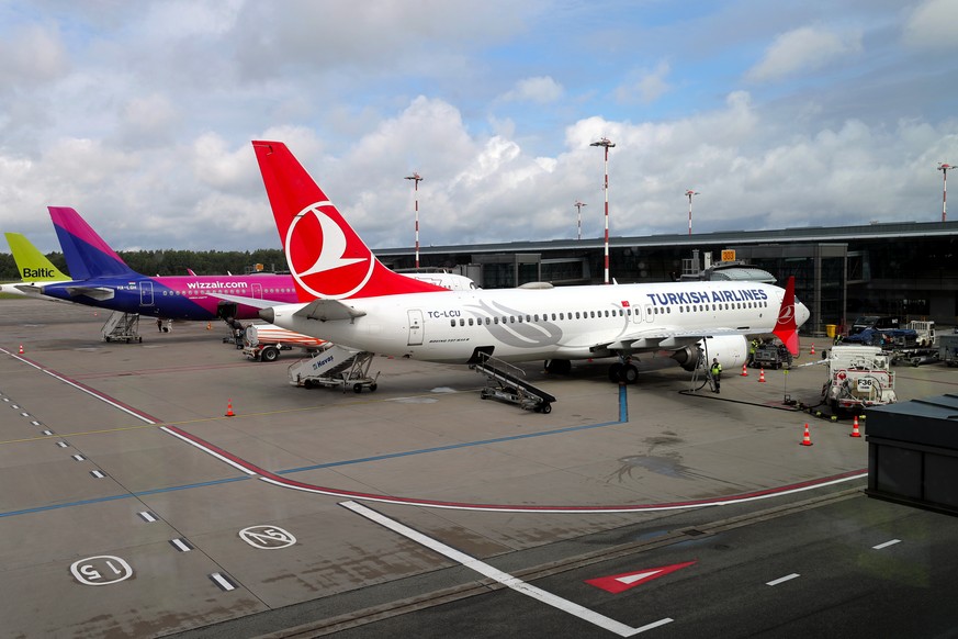 epa11455158 Turkish Airlines Boeing 737 MAX8 (R), Wizz Air Airbus A321-271NX (C) and airBaltic aircraft are seen at Riga Airport in Riga, Latvia, 03 July 2024. Riga Airport serves as a key Northern Eu ...