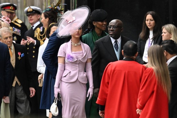 LONDON, ENGLAND - MAY 06: Katy Perry and Edward Enninful arrive at Westminster Abbey ahead of the Coronation of King Charles III and Queen Camilla on May 06, 2023 in London, England. The Coronation of ...