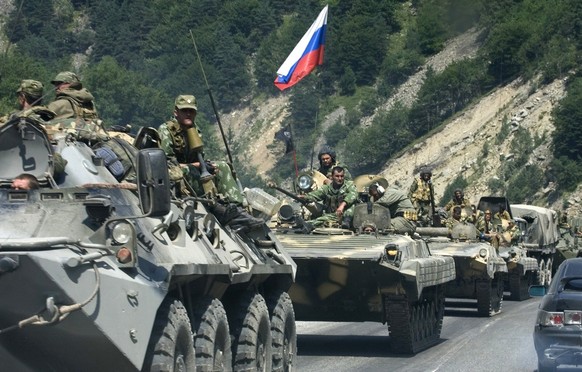 Russian heavy armoured vehicles in the Ardon Valley , Russia, heading towards the Georgian border and South Ossetia on Saturday, Aug. 9, 2008. Russia sent hundreds of tanks and troops into the separat ...