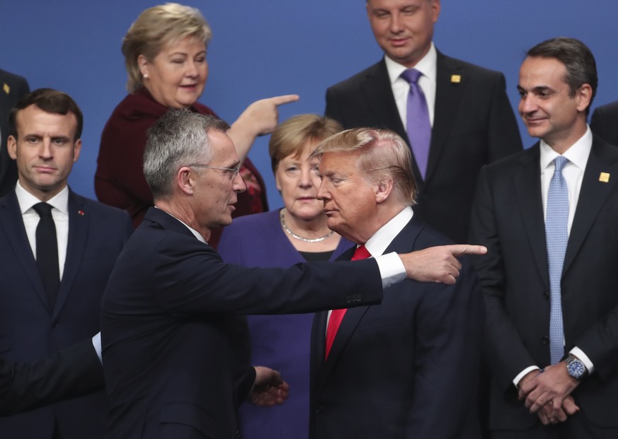FILE - NATO Secretary General Jens Stoltenberg, center front left, speaks with then-U.S. President Donald Trump, center front right, at a NATO leaders? meeting in Watford, England, Wednesday, Dec. 4,  ...