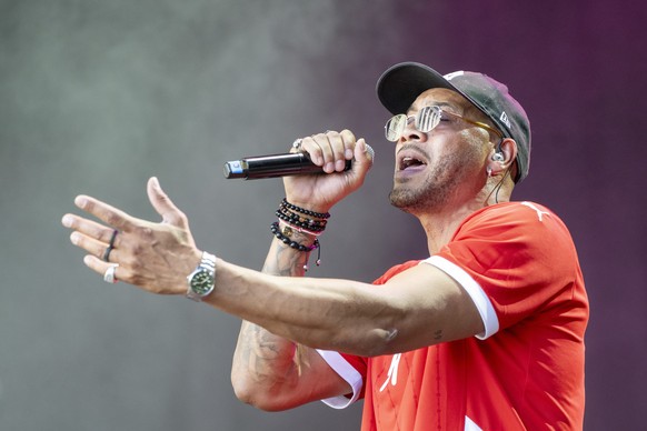 epa12245764 Former football player of the BSC Young Boys and singer Guillaume Hoarau holds a concert at the Fan Zone on the Bundesplatz square ahead of the UEFA Women&#039;s EURO 2025 quaterfinal socc ...