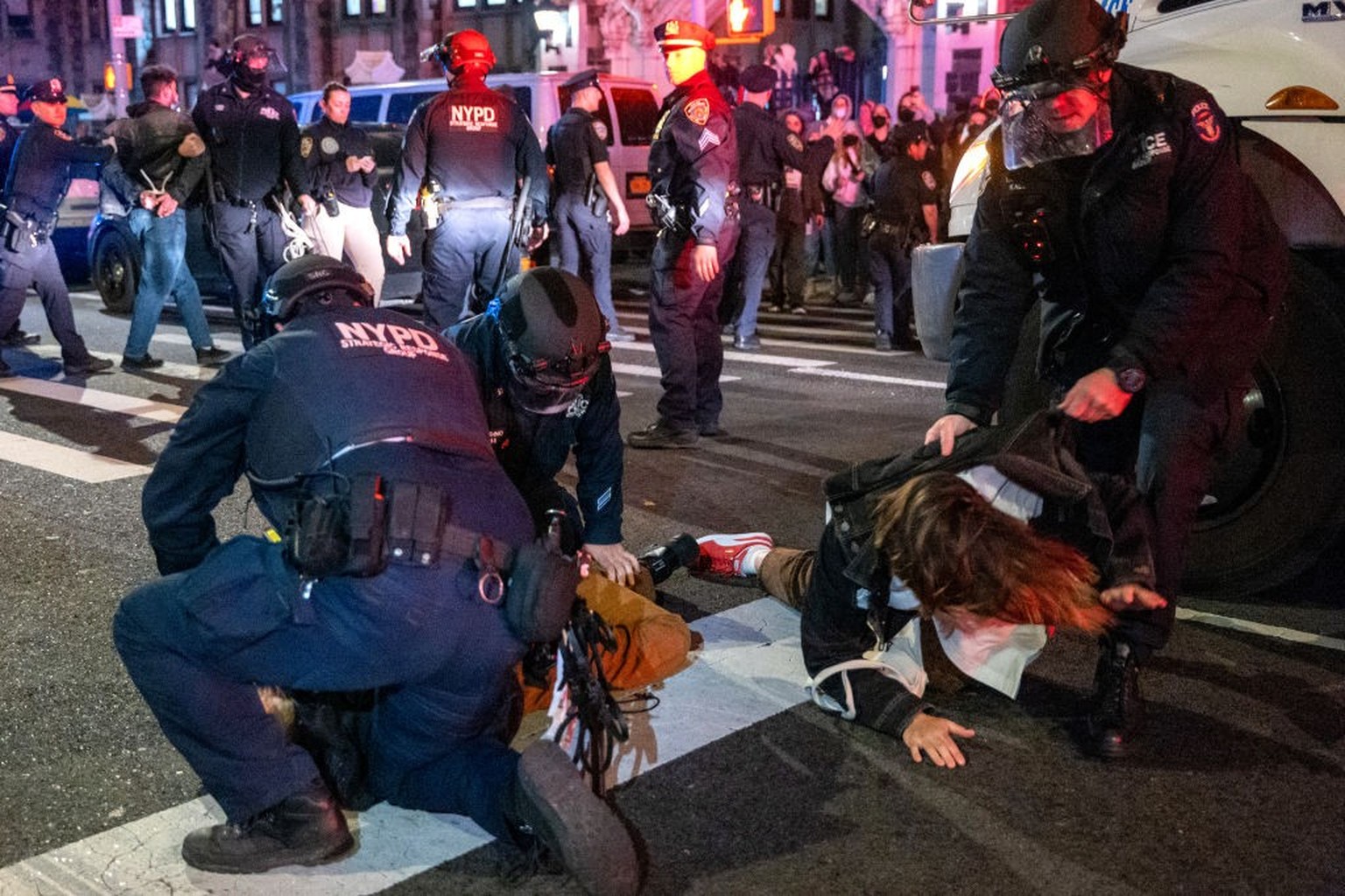 NEW YORK, NEW YORK - APRIL 30: Police arrest protesters during pro-Palestinian demonstrations at The City College Of New York (CUNY) as the NYPD cracks down on protest camps at both Columbia Universit ...