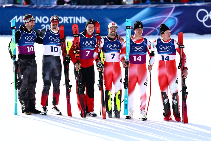 epa12719982 (L-R) Ex aequo second placed Vincent Kriechmayer and Manuel Feller of Austria 1, first placed Franco von Allmen and Tanguy Nef, and Ex aequo second placed Marco Odermatt and Loic Meillard  ...