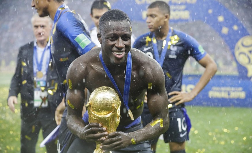 France&#039;s Benjamin Mendy holds the trophy at the end of the final match between France and Croatia at the 2018 soccer World Cup in the Luzhniki Stadium in Moscow, Russia, Sunday, July 15, 2018. (A ...