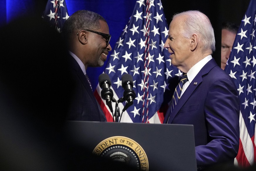 Derrick Johnson, president and CEO of the NAACP, left, greets President Joe Biden at the National Museum of African American History and Culture in Washington, Friday, May 17, 2024. (AP Photo/Susan Wa ...