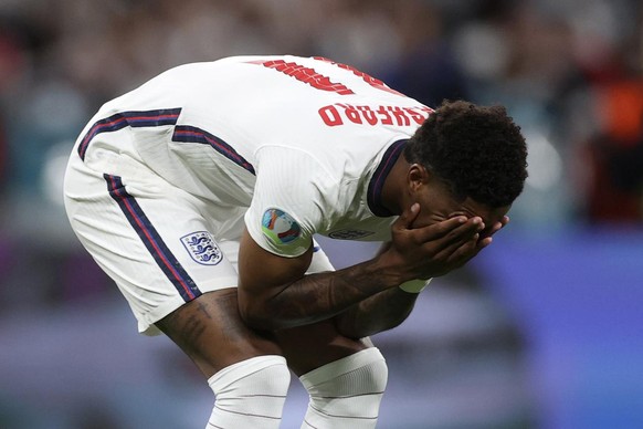 England&#039;s Marcus Rashford reacts after failing to score a penalty during a shootout at the end of the Euro 2020 soccer championship final match between England and Italy at Wembley stadium in Lon ...