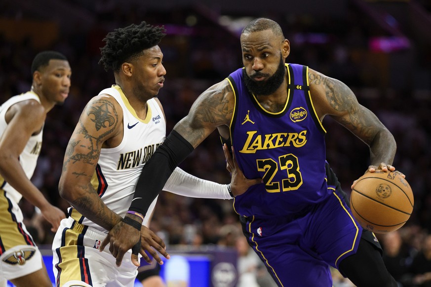 Los Angeles Lakers forward LeBron James (23) drives the ball against New Orleans Pelicans guard Elfrid Payton during the second half of an NBA basketball game Friday, April 4, 2025, in Los Angeles. (A ...