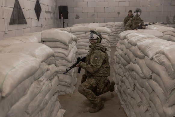 Ukrainian recruits using VR headsets complete basic military training at the Ukrainian Ground Forces training center in an undisclosed location on March 25, 2026, amid the Russian invasion of Ukraine. ...