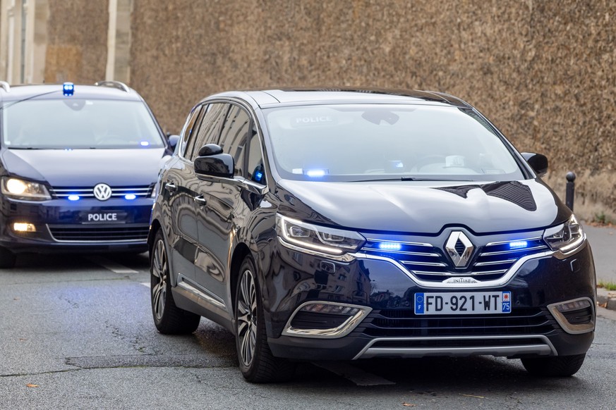 epa12516245 A police convoy escorts the car in which former French President Nicolas Sarkozy leaves La Sante prison after a court decision to release him, in Paris, France, 10 November 2025. A French  ...