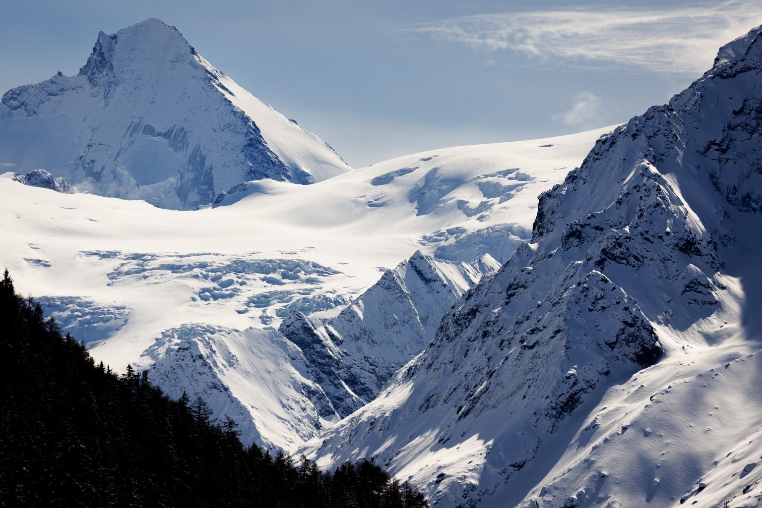 epa11214528 The Tete Blanche mountain snow field where five bodies were found (C) is pictured, in the Swiss Alps, near Sion, Switzerland, 11 March 2024. Five cross-country skiers who went missing duri ...