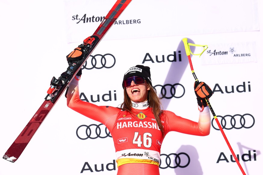 epa11818330 Second placed Malorie Blanc of Switzerland celebrates on the podium for the Women's Downhill race at the FIS Alpine Skiing World Cup in St. Anton, Austria, 11 January 2025. EPA/ANNA S ...