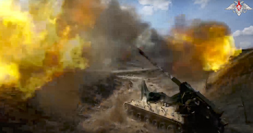 FILE - In this photo taken from video released by the Russian Defense Ministry Press Service on May 18, 2023, a Russian 152 mm self-propelled gun fires toward Ukrainian position at an undisclosed loca ...