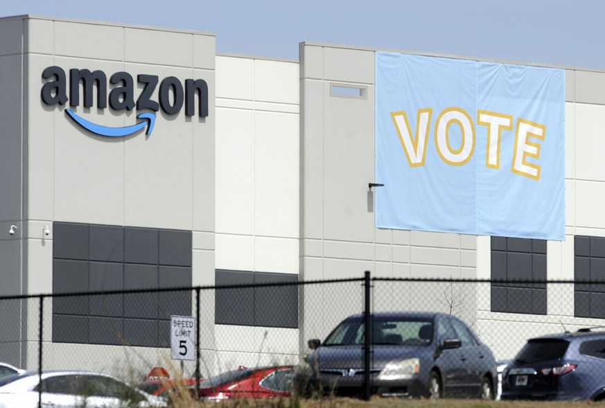 FILE - In this March 30, 2021 file photo, a banner encouraging workers to vote in labor balloting is shown at an Amazon warehouse in Bessemer, Ala. Despite the strongest public support and the most sy ...