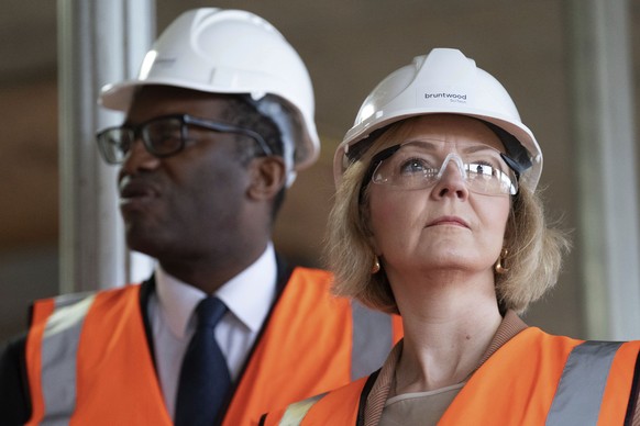 Britain&#039;s Prime Minister Liz Truss, foreground and Chancellor of the Exchequer Kwasi Kwarteng look on, during a visit to a construction site for a medical innovation campus, on day three of the C ...