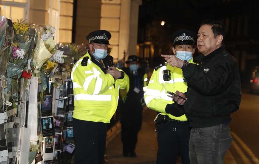 Kyaw Zwar Minn, right, the Myanmar ambassador, talks to police outside the Myanmar Embassy in London, Wednesday, April 7, 2021. Newspaper reports say the embassy was taken over by members of the count ...