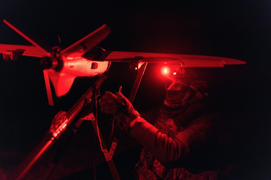A soldier of the 127th Separate Territorial Brigade launches a drone to search for Russian attack drones at the front line in the Kharkiv region Saturday, March 14, 2026. (AP Photo/Nikoletta Stoyanova ...