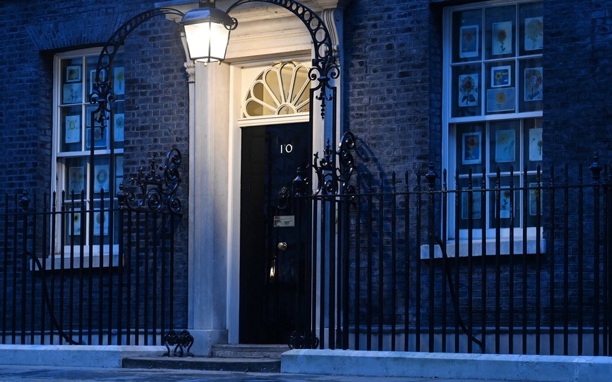 epa09857072 Ten Downing Street in London, Britain, 29 March 2022. The Metropolitan Police are expected to deliver lockdown breach fines over the Downing Street lockdown parties. It is yet unknown weth ...